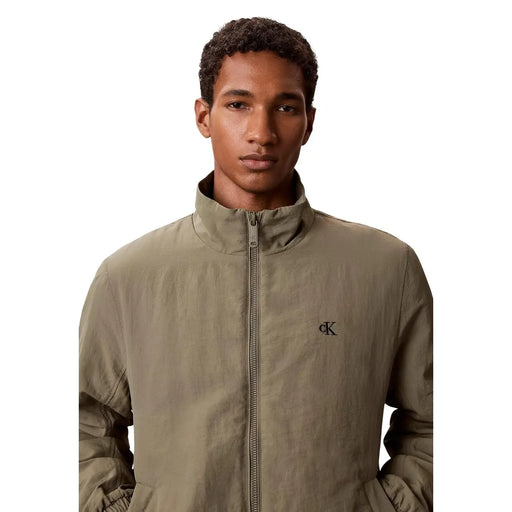 Calvin klein jeans men green nylon blazer featuring a subtle textured olive green zip-up jacket with embroidered logo