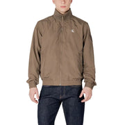 Veste zippée en polyamide beige Calvin Klein Jeans pour homme, avec logo discret sur la poitrine et poignets élastiques.