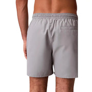 Calvin klein jeans men grey polyester swim shorts medium showing the back side with elastic waistband and single pocket