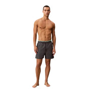 Calvin Klein Jeans men grey polyester swim shorts with dark gray trunks and light green elastic waistband logo