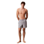 Calvin Klein Jeans men grey polyester swim shorts medium with a drawstring waistband for athletic use