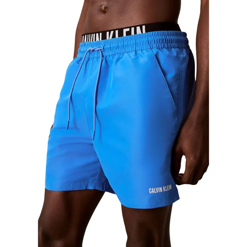 Calvin Klein Jeans men medium grey polyester swim shorts with bright blue swim trunks and black waistband details