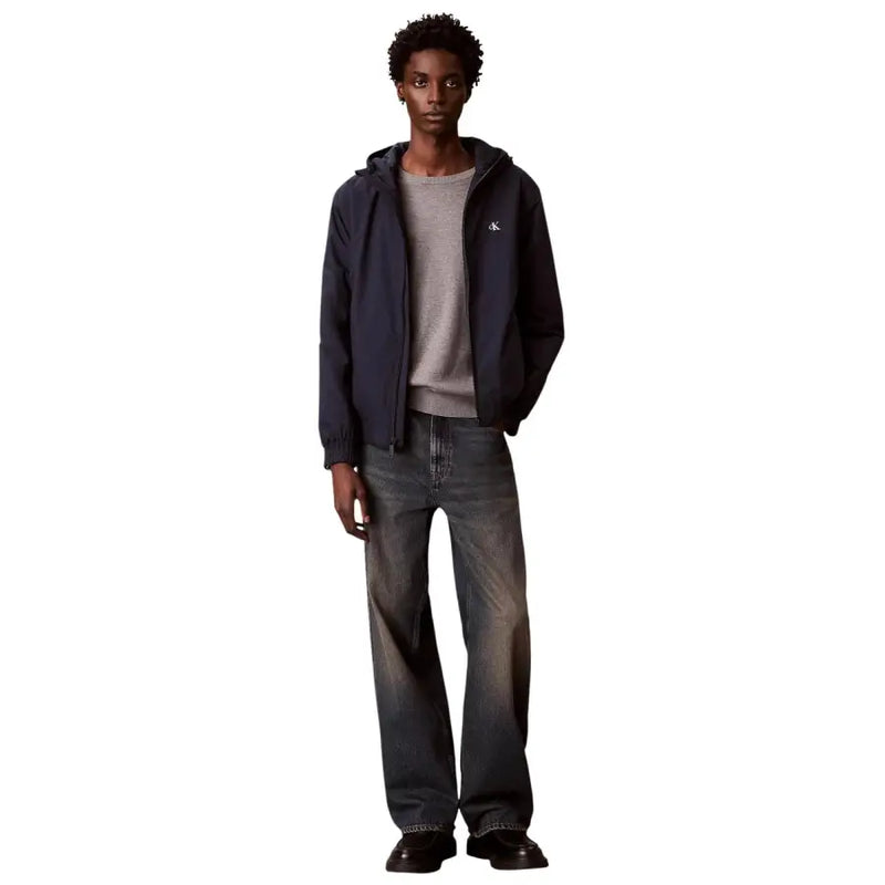 Calvin Klein Jeans men hooded navy blue polyester jacket with subtle white logo on left chest front side