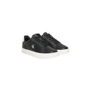 Calvin Klein Jeans men leather sneakers in black with white rubber soles and contrasting white logo on the side