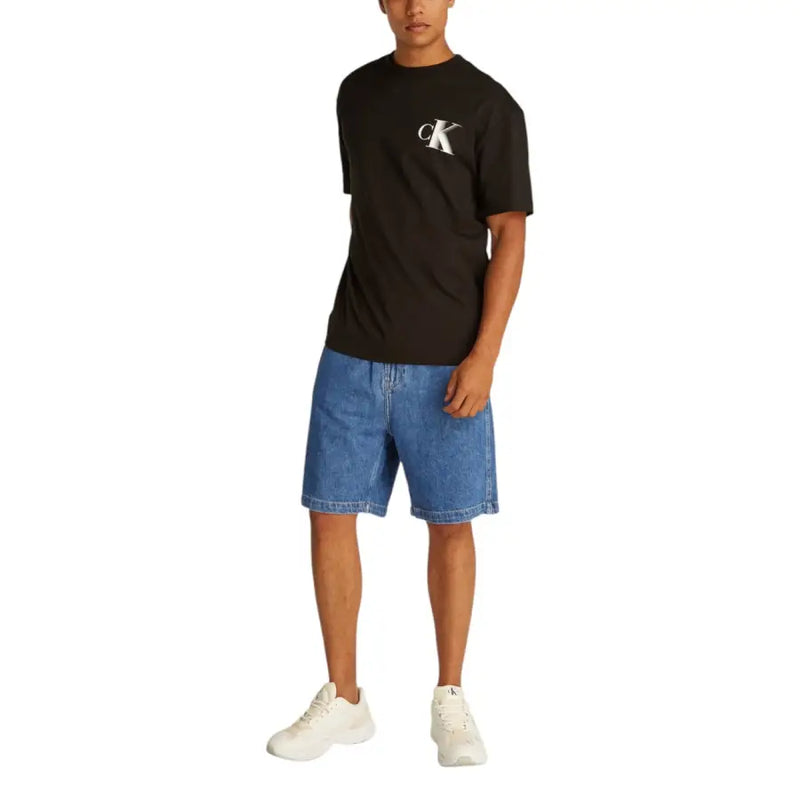 Black Calvin Klein t-shirt with a white CK logo paired with light blue cotton Calvin Klein Jeans men shorts