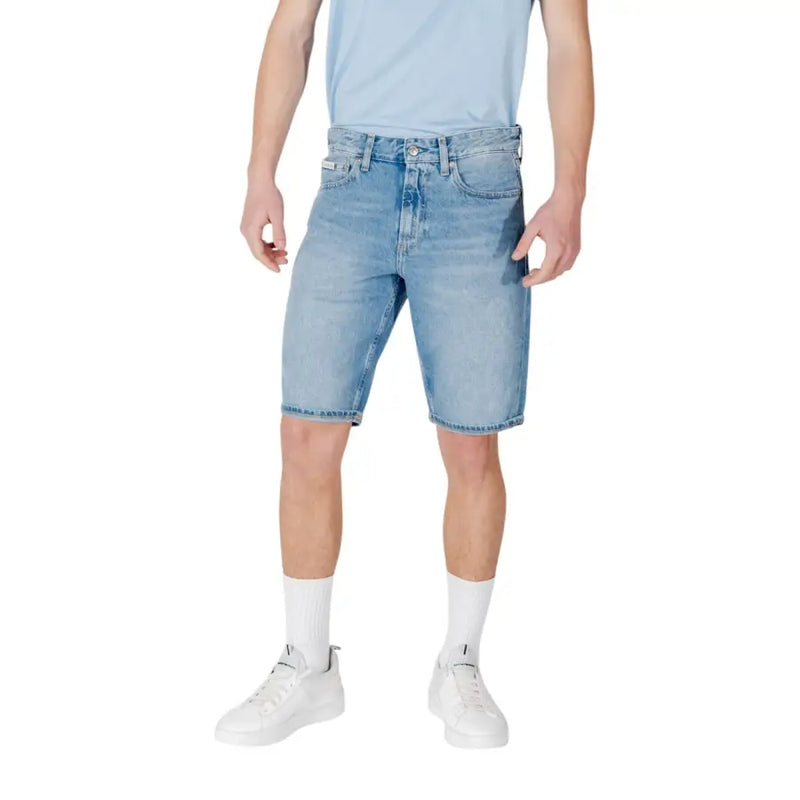 Calvin Klein Jeans men light blue cotton shorts featuring light-wash denim with five pockets and distressed detailing