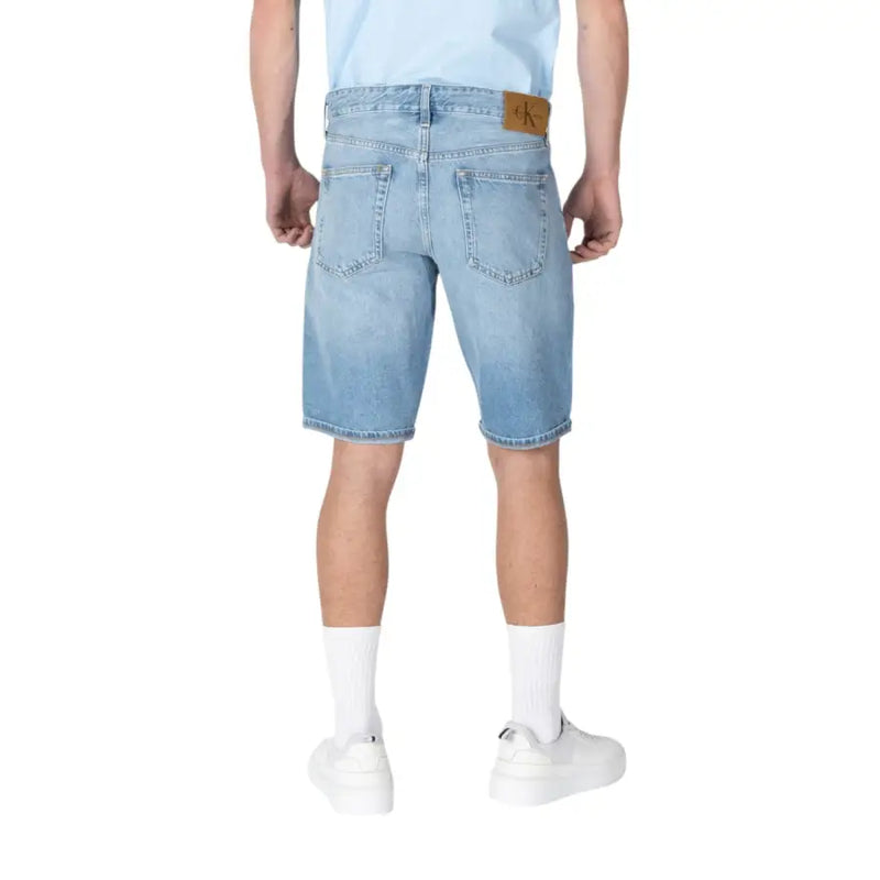 Calvin Klein Jeans men light blue cotton shorts with light-wash denim, classic five-pocket design, and brown leather patch