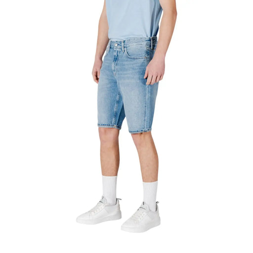 Calvin Klein Jeans men light blue cotton shorts in light-wash denim with classic five-pocket design and frayed hem