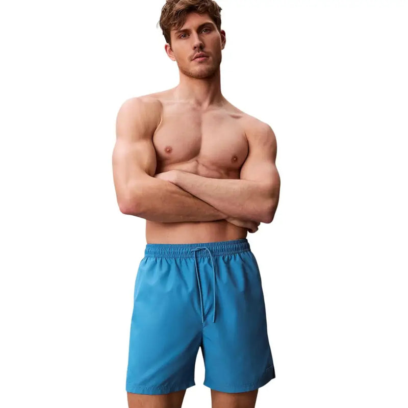 Calvin Klein Jeans men light blue polyester swim shorts with bright blue swim trunks and drawstring waistband