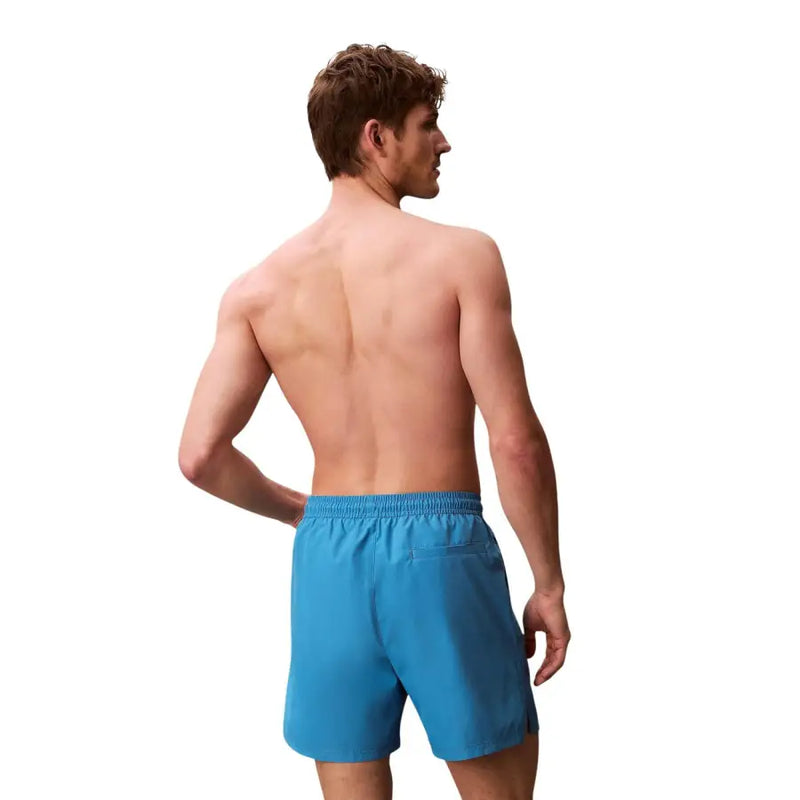 Calvin Klein Jeans men light blue polyester swim shorts with elastic waistband and small side pocket