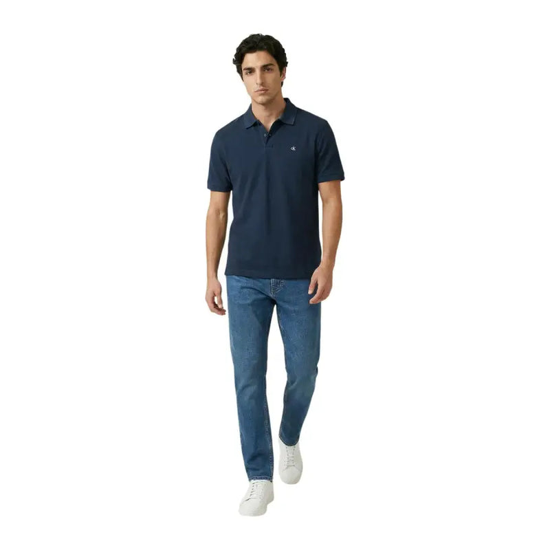 Navy blue cotton short sleeve polo shirt by Calvin Klein Jeans with small embroidered logo on left chest size L