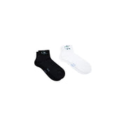 Black and white Calvin Klein Jeans men ankle socks with subtle logo on cuff for casual wear