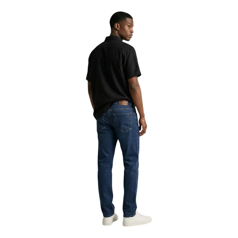 Dark blue denim jeans with a classic five-pocket design and faded wash in Calvin Klein Jeans men shirt product