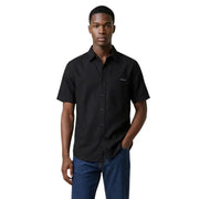 Calvin Klein Jeans men shirt in black with short sleeves, button-up front, chest pocket, and minimalist branding