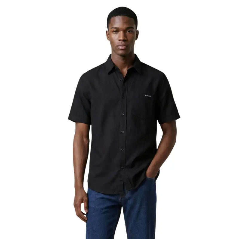 Calvin Klein Jeans men shirt in black with short sleeves, button-up front, chest pocket, and minimalist branding