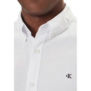 Calvin Klein Jeans men shirt in white with subtle textured weave and black embroidered logo on the left chest