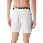 White Calvin Klein Jeans men swimwear swim trunks with black elastic waistband and white logo lettering