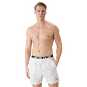 White Calvin Klein Jeans men swimwear trunks with black waistband and white logo lettering for swimming use