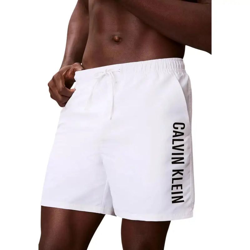 White Calvin Klein Jeans men swimwear swim trunks with black vertical branding on the side
