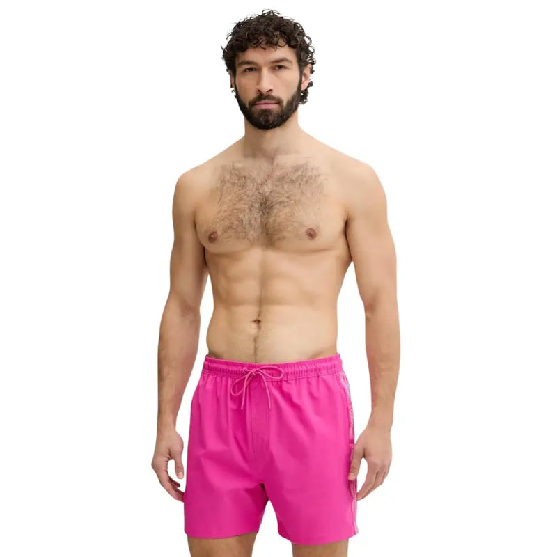 Calvin Klein Jeans men swimwear bright pink swim trunks with drawstring waistband and subtle side stripes