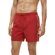 Calvin Klein Jeans men swimwear red swim trunks with white logo stripe along the side for beachwear use