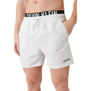 Calvin Klein Jeans men swimwear white swim trunks with black elastic waistband and embroidered logo on right leg