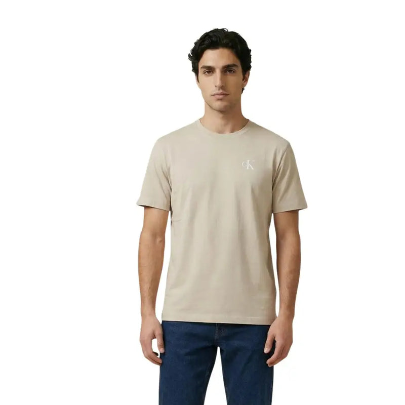 Beige Calvin Klein Jeans men t-shirt with subtle white logo on the left chest, casual cotton fabric