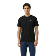 Calvin Klein Jeans men t-shirt in black cotton featuring a small white CK logo on the left chest
