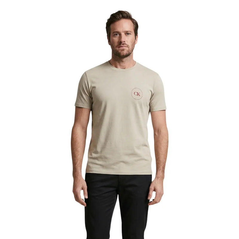 Beige Calvin Klein Jeans men t-shirt with subtle red CK logo on left chest, casual cotton top