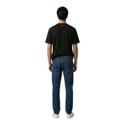 Dark blue denim jeans with classic five-pocket design and brown leather patch at waistband paired with calvin klein black cotton t shirt