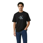 Black Calvin Klein Jeans men t-shirt with prominent embroidered ck logo in teal and silver detailing