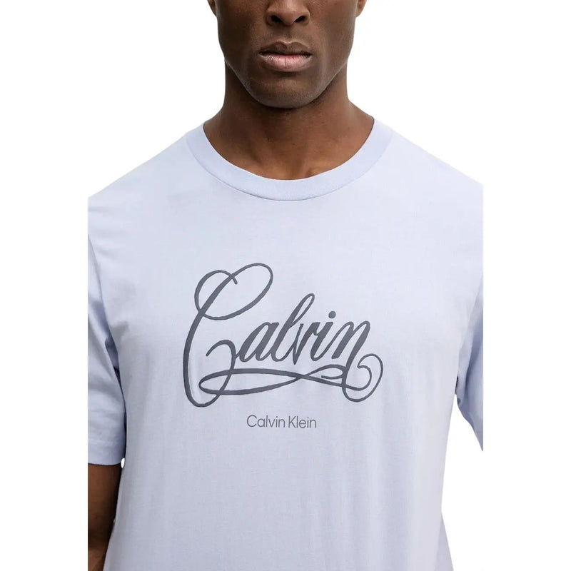 Light blue cotton Calvin Klein Jeans men t-shirt with dark gray cursive Calvin logo and round neck in size S