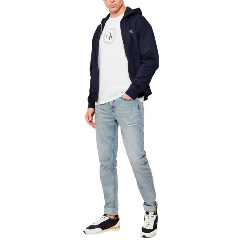 Marineblau Calvin Klein Jeans Kapuzenpullover mit Reißverschluss, weißem runden Logo auf der Brust und passendem Emblem am linken Ärmel