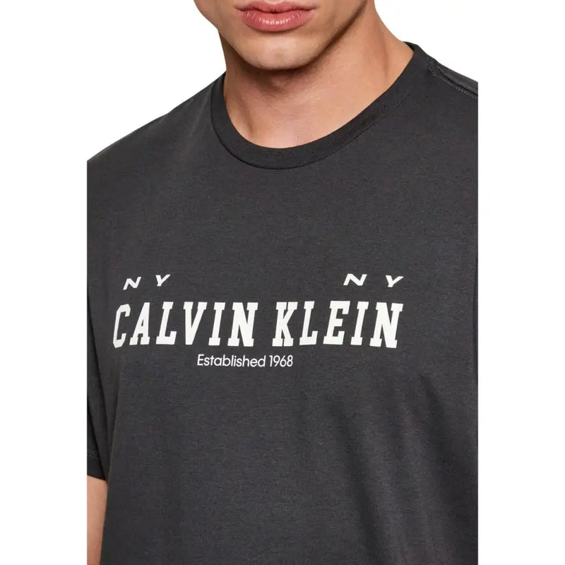 Dark gray Calvin Klein Jeans men t-shirt with bold white logo and NY NY established 1968 printed on front