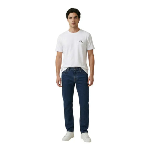 Calvin Klein Jeans men t-shirt in white cotton with a small black CK logo on the left chest