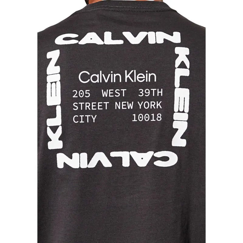 Black Calvin Klein Jeans men t-shirt with bold white graphic and modern font displaying brand name and New York address