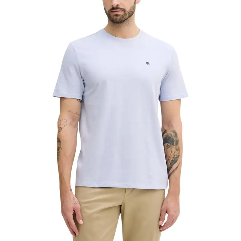 Light blue Calvin Klein Jeans men t-shirt with crew neck and small black logo on the left chest in cotton material