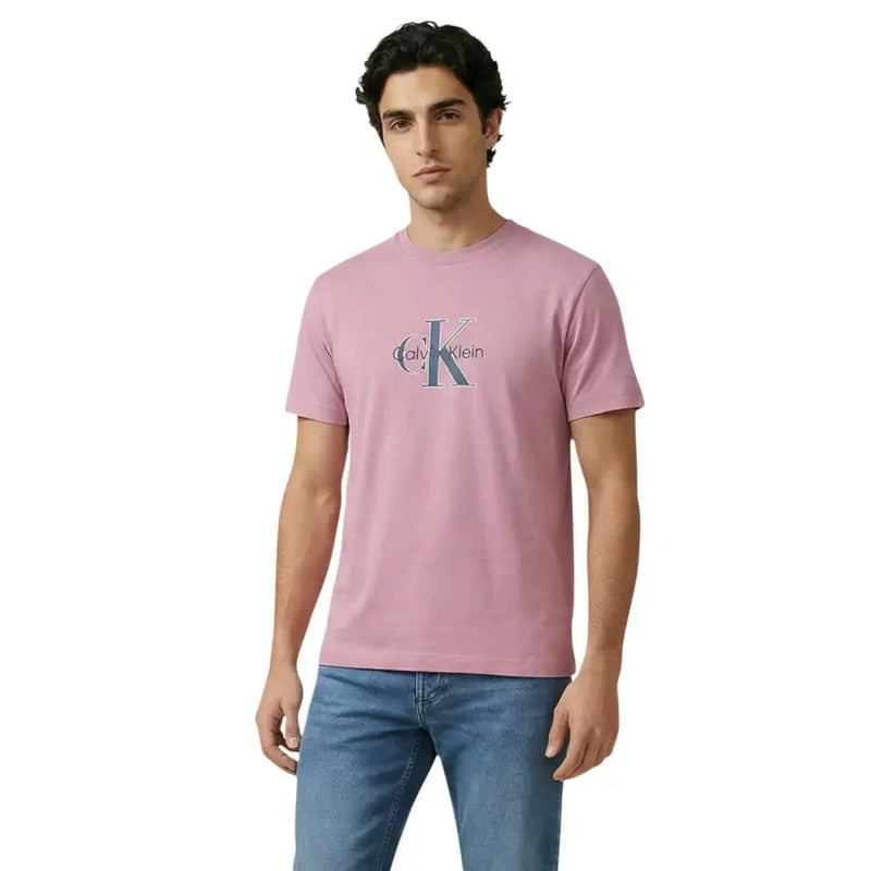 A soft pink Calvin Klein Jeans men t-shirt featuring a classic logo print on the chest in cotton fabric