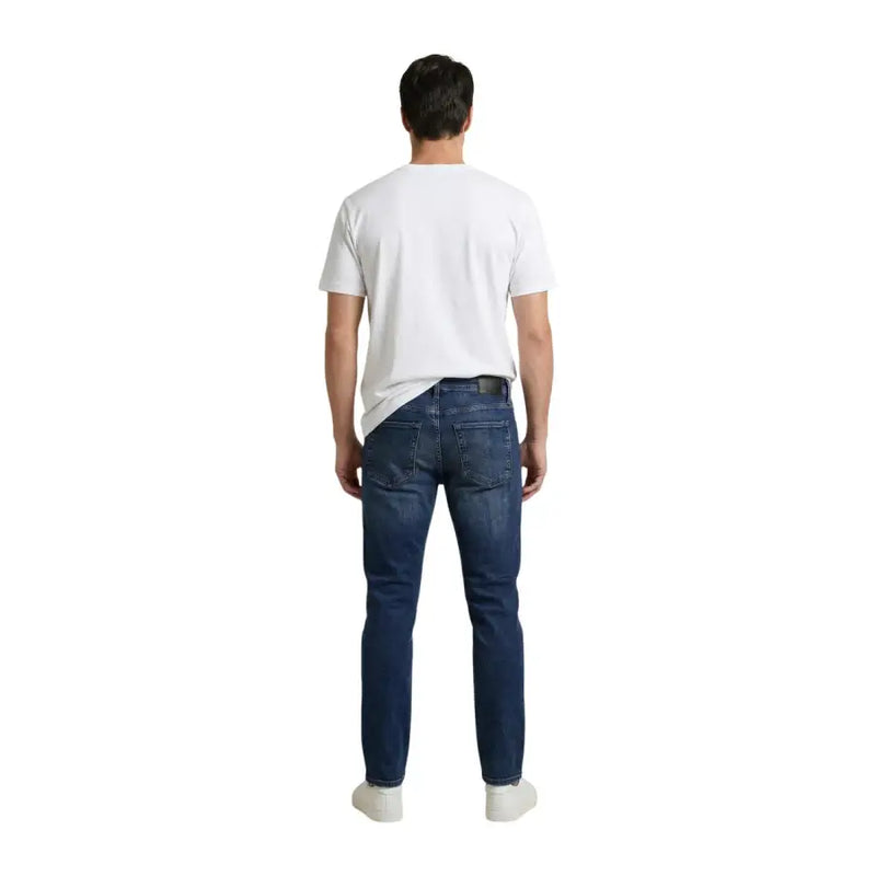 Calvin klein jeans men t shirt white cotton print paired with dark blue slim fit denim jeans with a classic five-pocket design