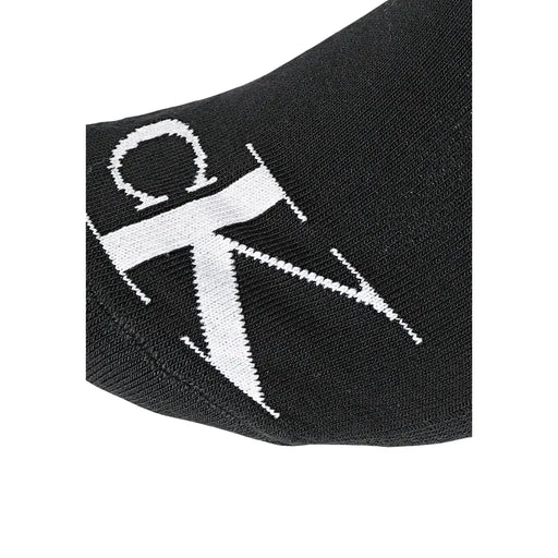 Black Calvin Klein socks featuring a bold white CK logo knitted into the fabric for men’s underwear use