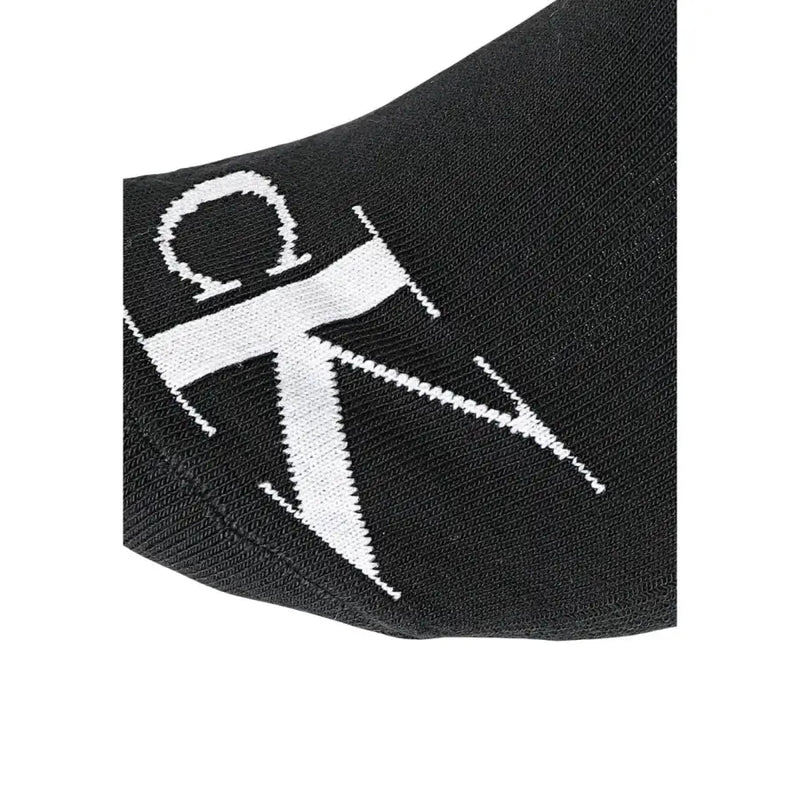 Schwarz Calvin Klein Socken mit einem markanten weißen CK-Logo, das in den Stoff eingestrickt ist, zur Verwendung als Herrenunterwäsche