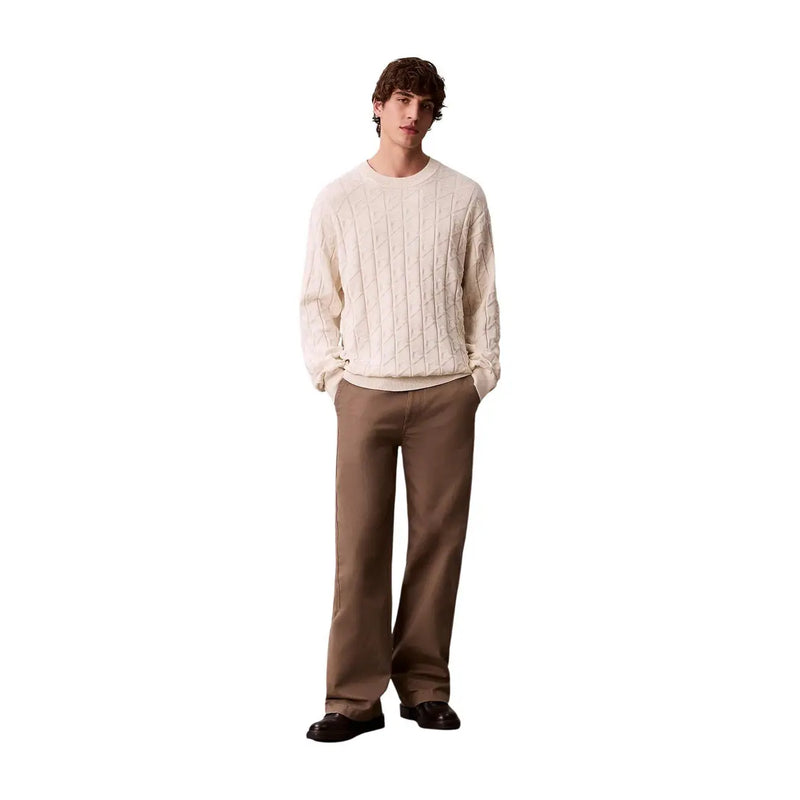 Cream-colored cable-knit cotton sweater with classic crew neck and long sleeves from Calvin Klein Jeans men collection