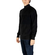 Black turtleneck sweater with ribbed knit texture by Calvin Klein Jeans