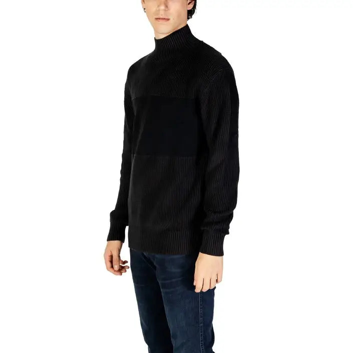Black turtleneck sweater with ribbed knit texture by Calvin Klein Jeans