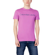 Calvin Klein Jeans men’s vibrant pink t-shirt with subtle navy blue logo across the chest for casual wear