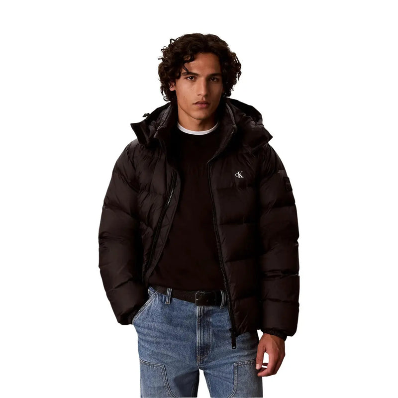 Calvin Klein Jeans puffer jacket for men in black with quilted design hood and subtle logo, front view