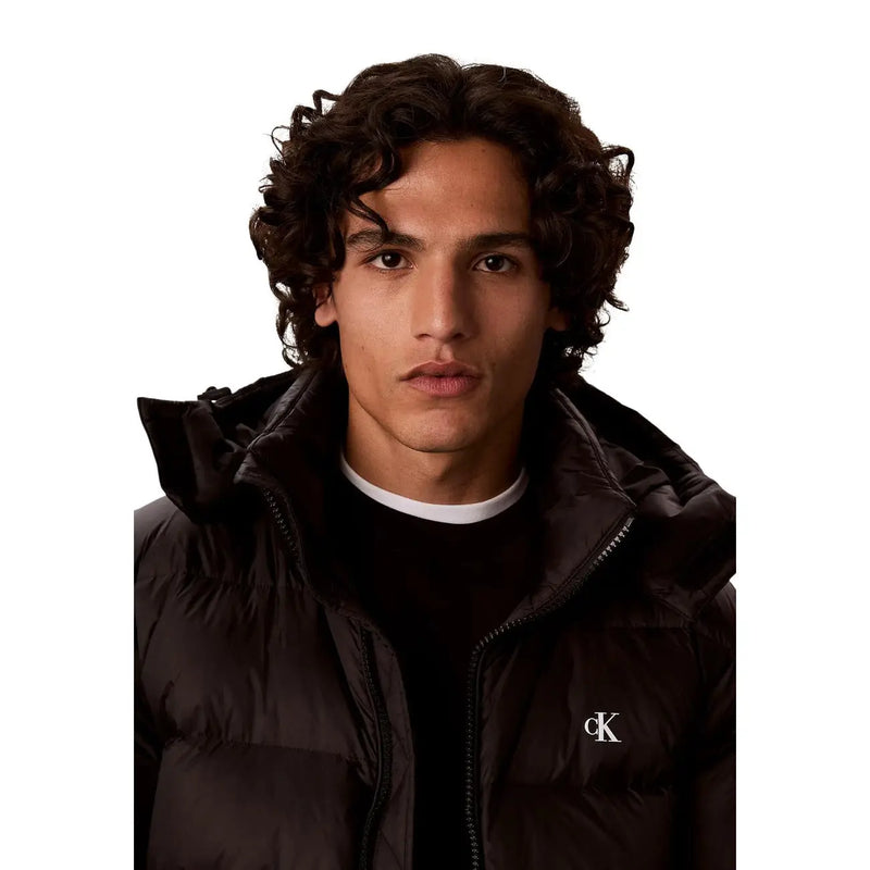 Calvin Klein Jeans puffer jacket for men in black with quilted design and white ck logo, front view