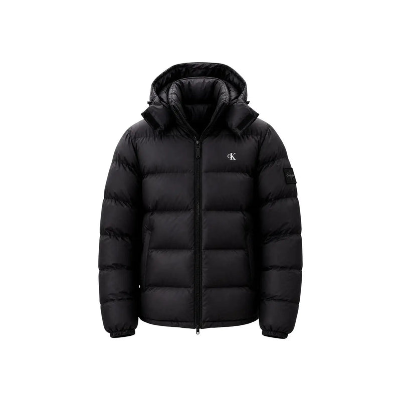Calvin Klein Jeans puffer jacket for men in black quilted fabric with hood and subtle logo on chest and sleeve, front view
