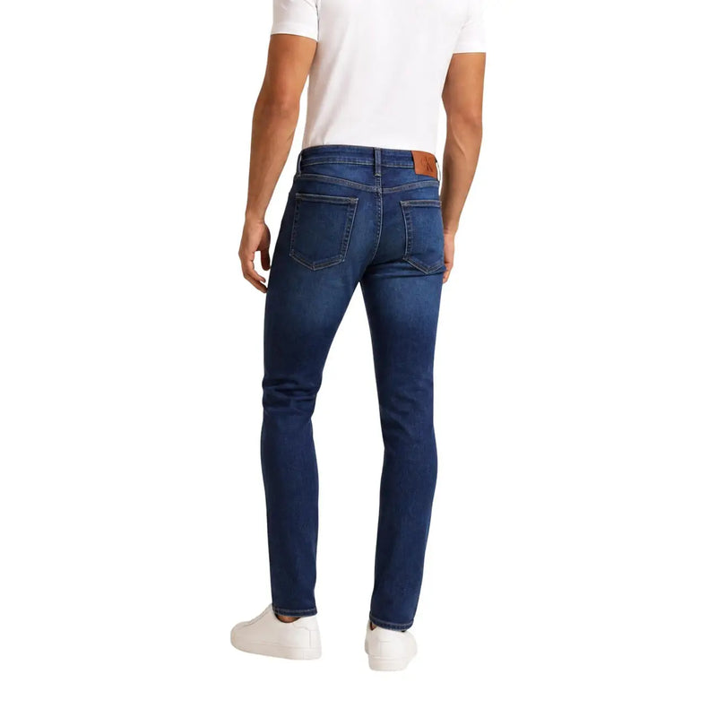 Calvin Klein Jeans Jean slim pour homme en denim bleu foncé avec empiècement en cuir marron à la taille, vue de face