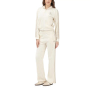 Beige cotton calvin klein jeans women trousers with subtle embroidered logos on thigh and matching zip-up track top